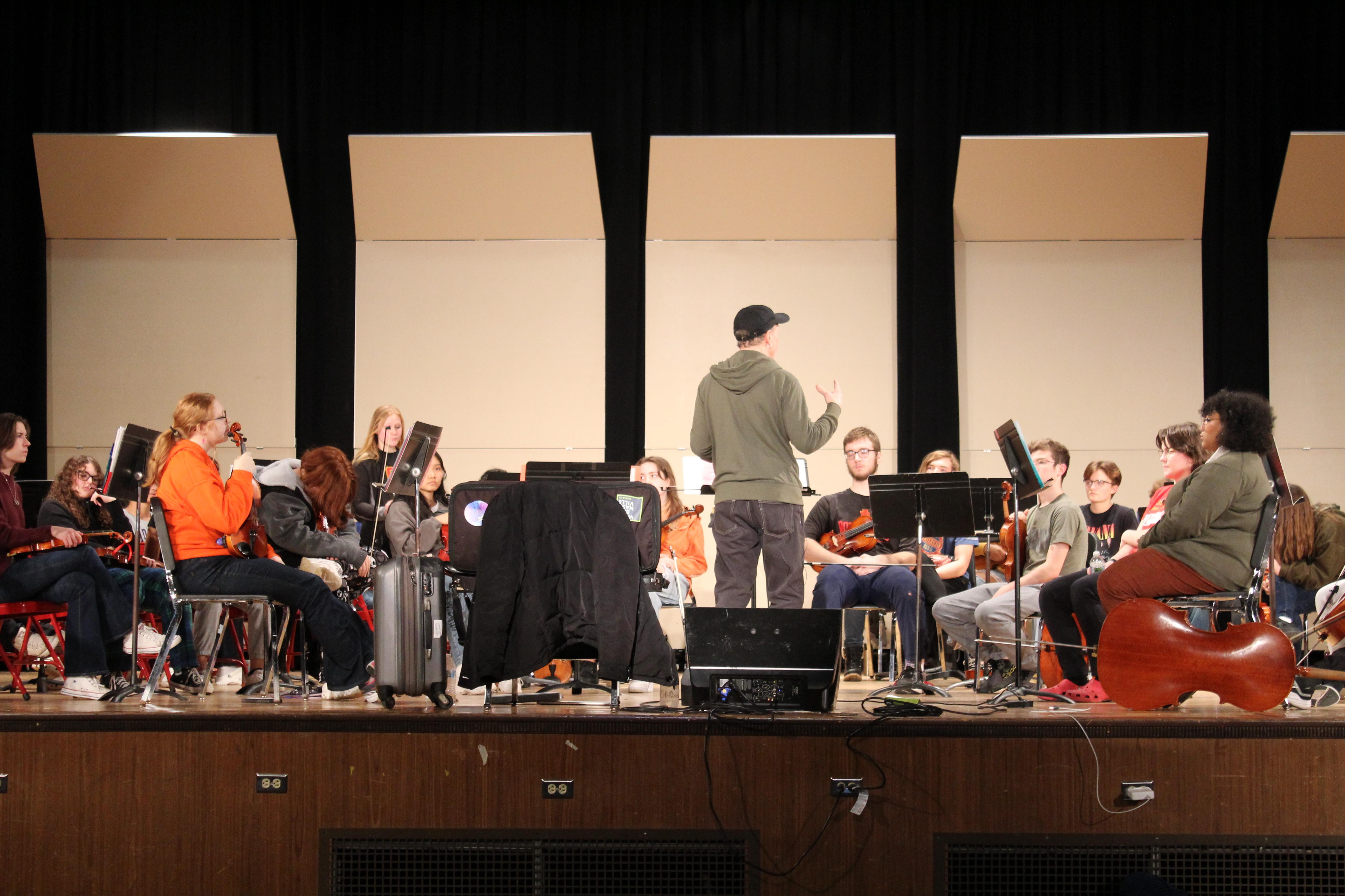 Tracy Silverman practicing with RIHS orchestra students
